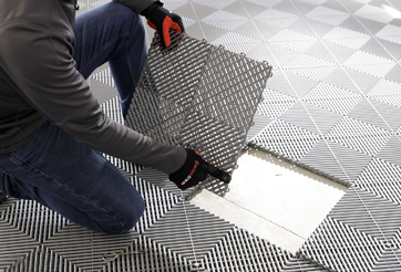 Grey Swisstrax Tile Covers Concrete Crack