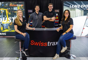 Smiling Man with Headset Looking at Monitor