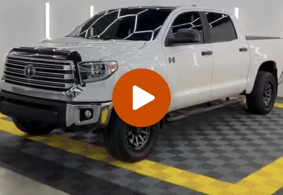 Video Thumbnail - bright white truck with dark tint in a Tint World shop