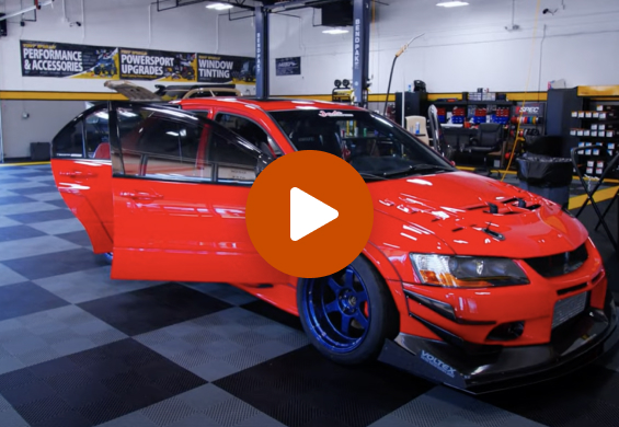 Video Thumbnail - red sports car with passenger side doors open in Tint World Houston shop