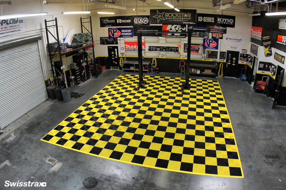 Rockstar's garage using Swisstrax's Ribtrax Pro floor tiles