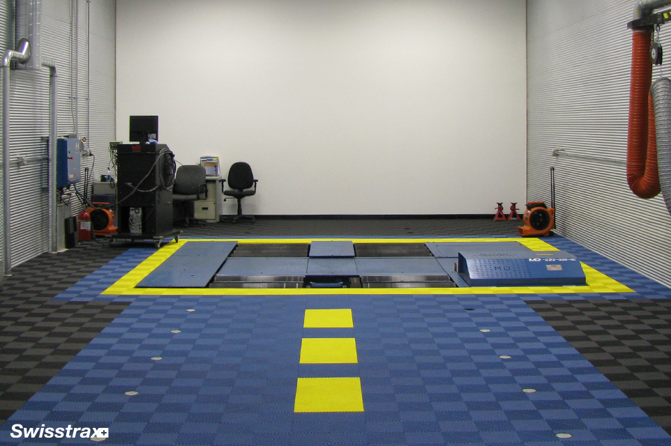 Design your garage floor tiles to create a pathway to the car lift