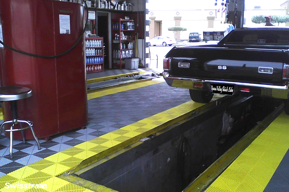 Ribtrax Pro tiles installed in the garage with an oil change pit