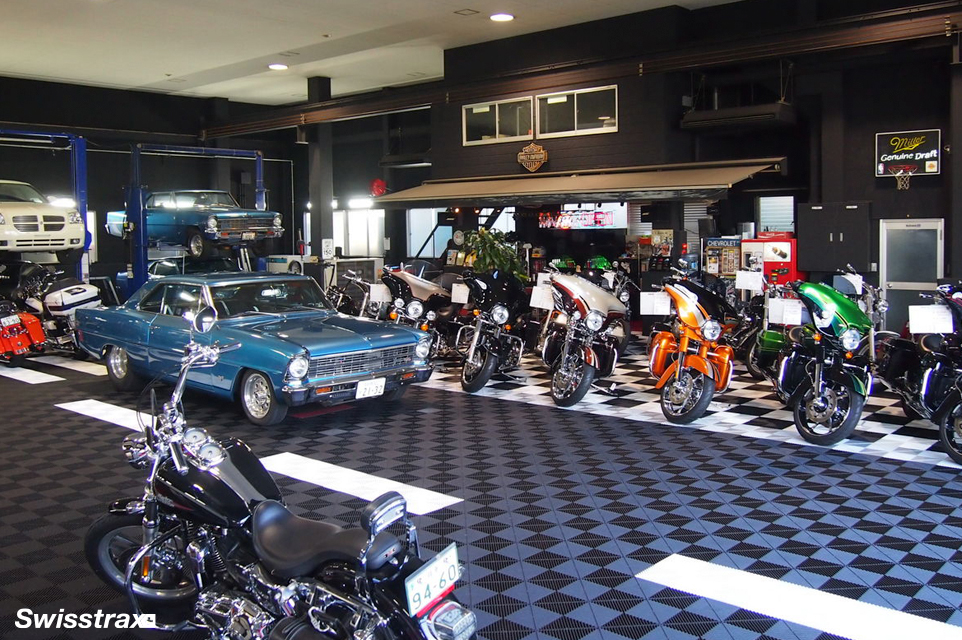 Commercial garage with black Ribtrax Pro tiles installed