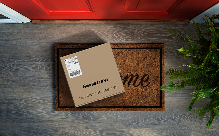 Kraft Sample Box with Shipping Label on Welcome Mat