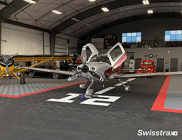 Private hangar using Ribtrax Pro tiles for flooring