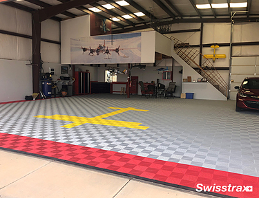 Airplane hangar with Swisstrax flooring installed