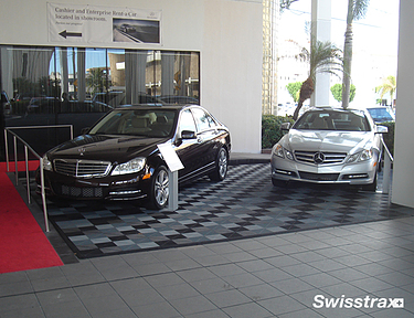 Mercedes dealership showroom cars parked on top of Swisstrax flooring