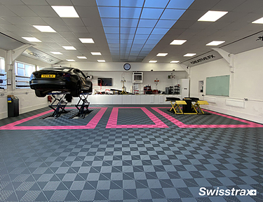 Tint and wrap shop installed with red and black floor tiles from Swisstrax