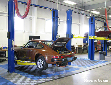 Swisstrax floor tiles installed in car bays