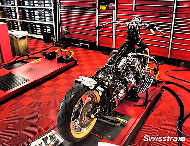 Motorcycle garage service center installed with floor tiles from Swisstrax