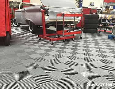Auto repair garage using Swisstrax interlocking floor tiles