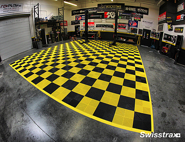 Yellow and black garage floor mat installed