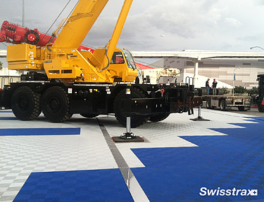 Construction trade show event using white and blue interlocking floor tiles from Swisstrax