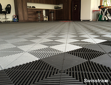 Closeup of Swisstrax Ribtrax floor tiles in a garage