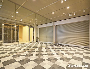 1 car garage with checkered pattern garage flooring