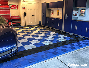 2 car garage with blue, black, and white Ribtrax Pro tiles installed