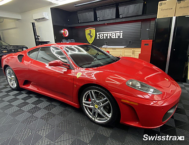 Ferrari theme garage with black Swisstrax floor tiles installed
