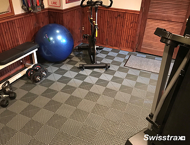 Ribtrax Smooth Pro tiles installed in a small home gym