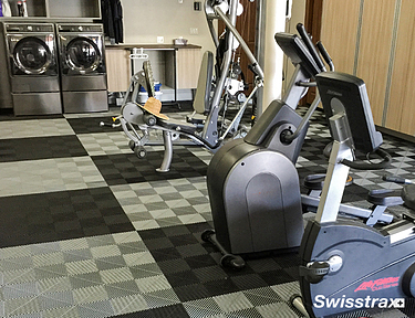 Ribtrax Smooth Pro tiles installed in a home gym in the basement