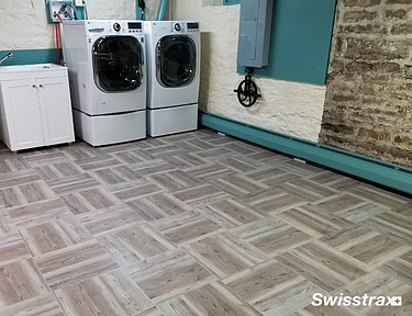 Vinyltrax Pro tiles installed in the laundry room located in the basement