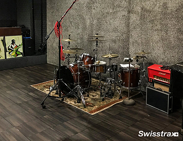 Man cave studio featuring Swisstrax wood-look, waterproof tile