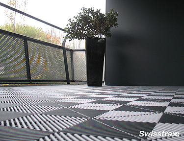 Closeup of Ribtrax Smooth Pro tiles on a balcony