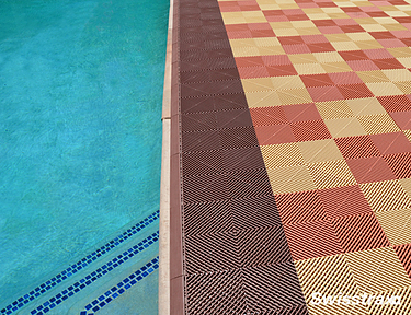 Swisstrax flooring with edges installed around a pool