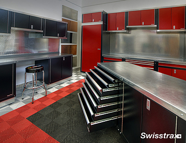 Garage workshop with white, red, and black floor tiles from Swisstrax