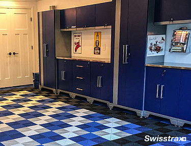 Blue and white garage floor tiles to match blue garage storage cabinets