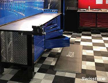 Swisstrax modular flooring underneath garage tool bench
