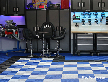 Garage workshop with blue and white checkerboard pattern floor tiles